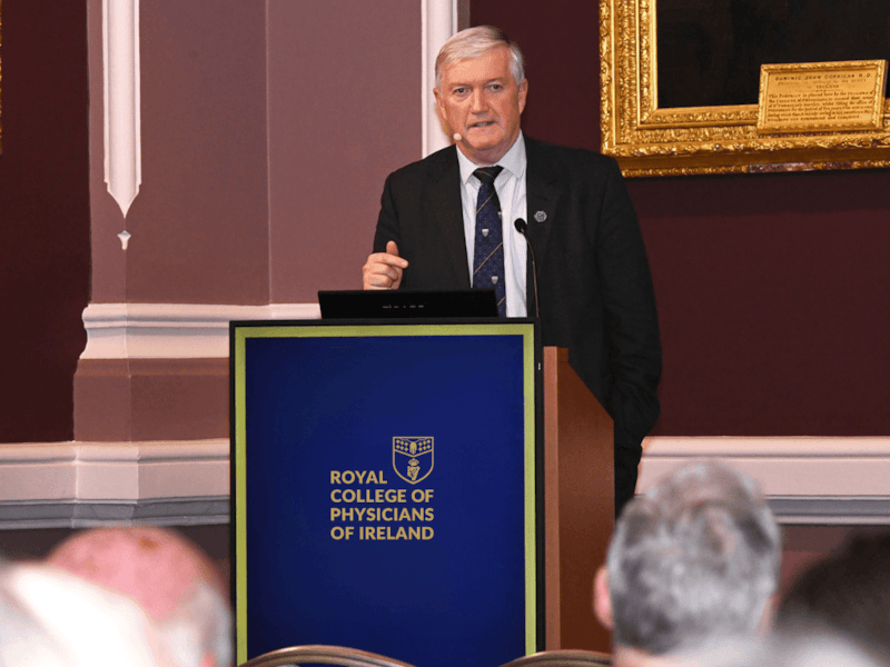 Dr Diarmuid O'Shea, President of RCPI, speaking at a podium at event